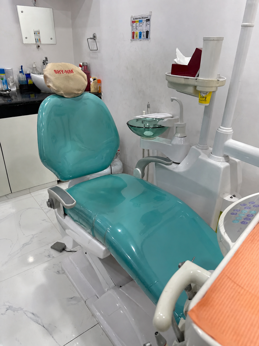 Modern teal dental chair at Vijay Dental Clinic
